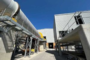 Pulper drum and compactor building